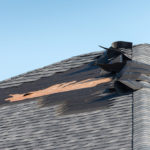 Clogged gutter could spell a roofing disaster. 